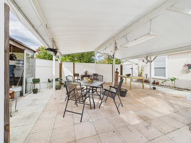 view of patio / terrace featuring fence and outdoor dining space