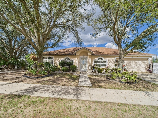 ranch-style house with stucco siding