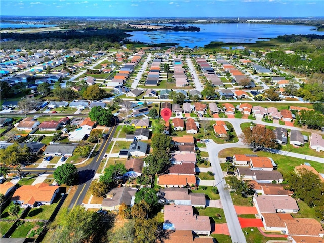 bird's eye view featuring a residential view and a water view