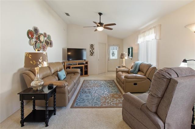 living room with light colored carpet, visible vents, ceiling fan, and lofted ceiling