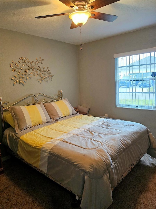 bedroom featuring ceiling fan and carpet flooring