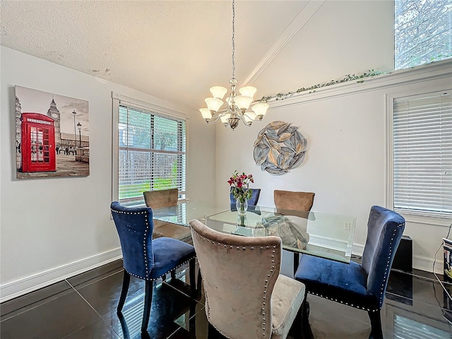 dining area featuring lofted ceiling, a textured ceiling, baseboards, and an inviting chandelier