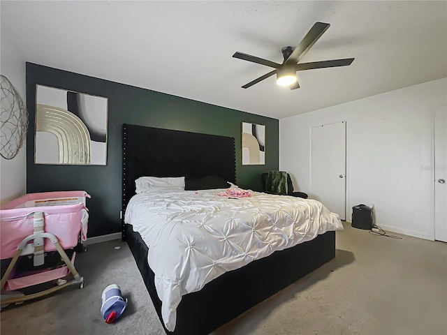 bedroom with ceiling fan, carpet, and baseboards