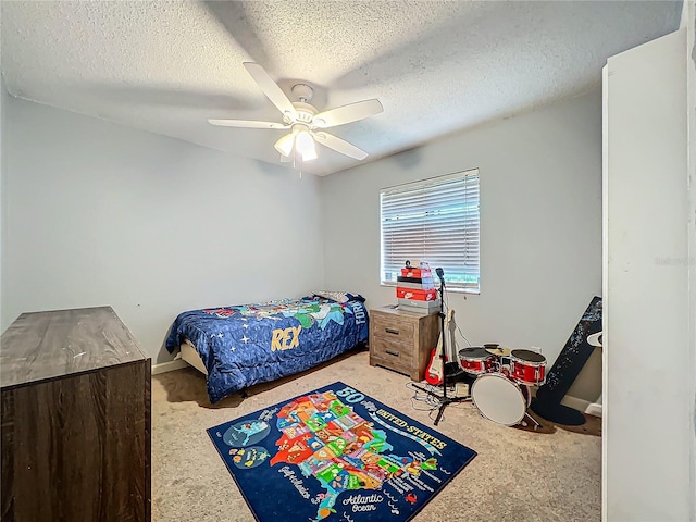 bedroom featuring a ceiling fan and a textured ceiling