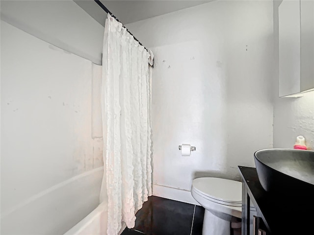 bathroom featuring toilet, shower / tub combo with curtain, and vanity