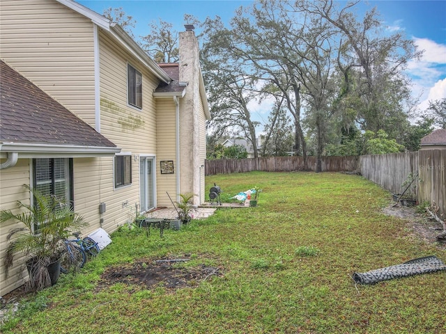 view of yard with a fenced backyard