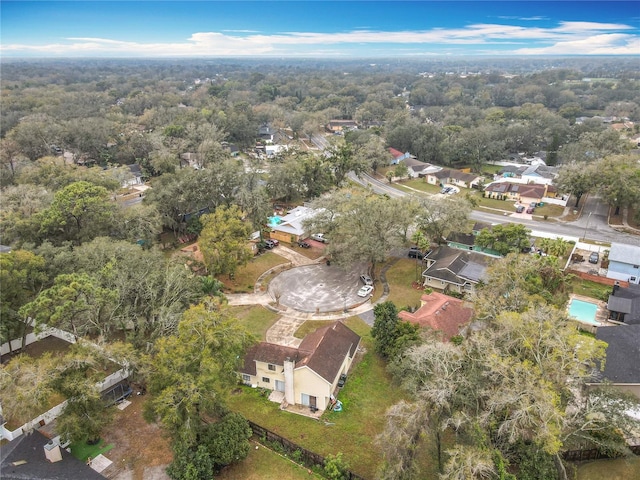 birds eye view of property featuring a wooded view