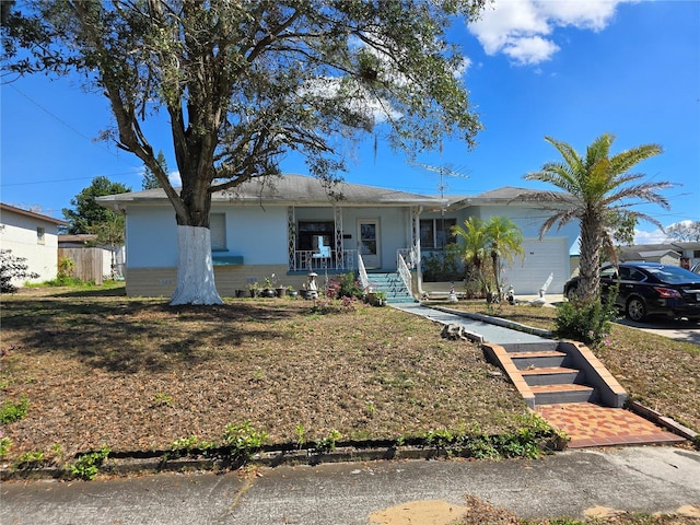 ranch-style house featuring a garage and a porch