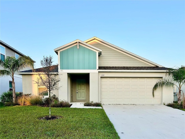 view of front facade featuring stucco siding, concrete driveway, an attached garage, board and batten siding, and a front yard