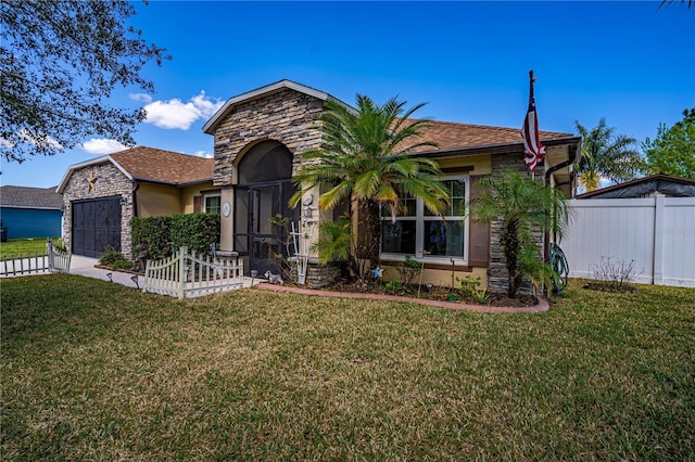 view of front facade with concrete driveway, fence, a garage, stone siding, and a front lawn