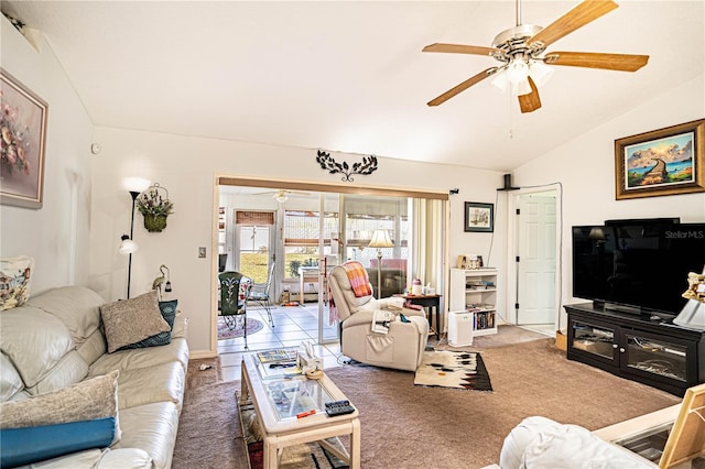 living room featuring carpet flooring, vaulted ceiling, and ceiling fan