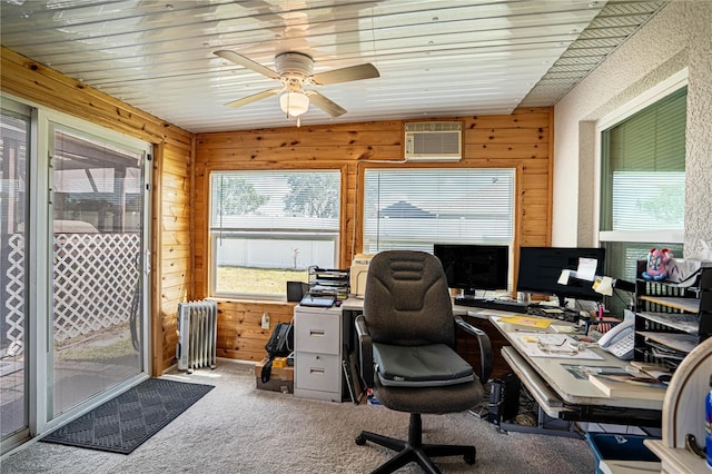 carpeted office space with plenty of natural light, wooden walls, radiator heating unit, and a wall mounted AC