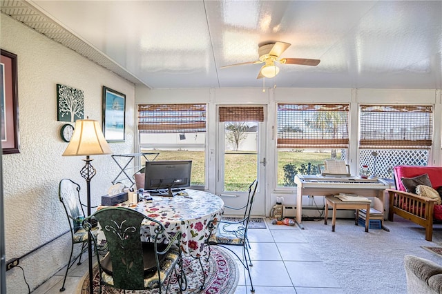 sunroom with a ceiling fan