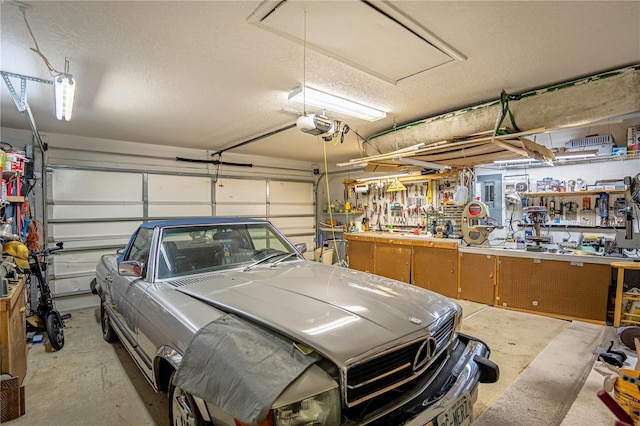 garage featuring a workshop area and a garage door opener