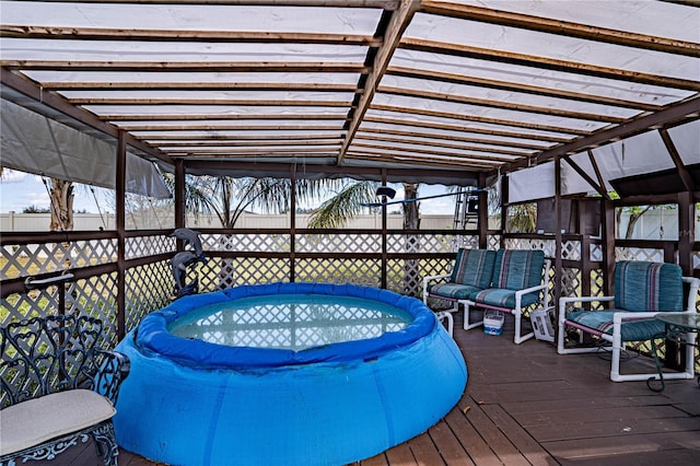 wooden terrace featuring glass enclosure