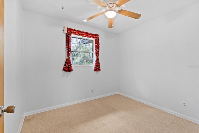 empty room featuring carpet flooring, ceiling fan, and baseboards