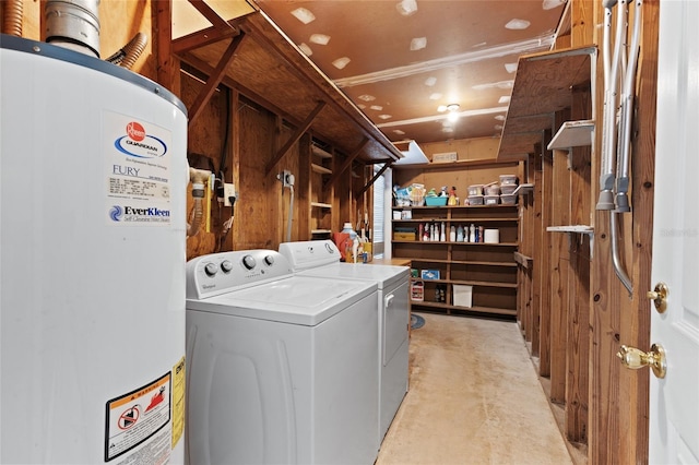 clothes washing area featuring water heater and separate washer and dryer