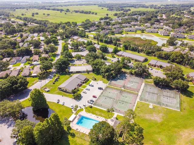 drone / aerial view featuring a residential view and a water view