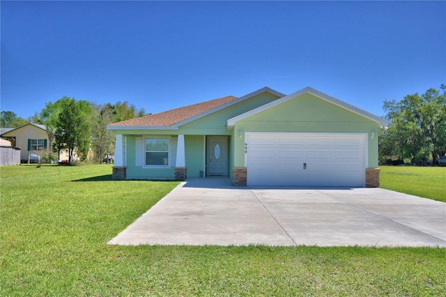 view of front of property with a garage, stucco siding, driveway, and a front yard