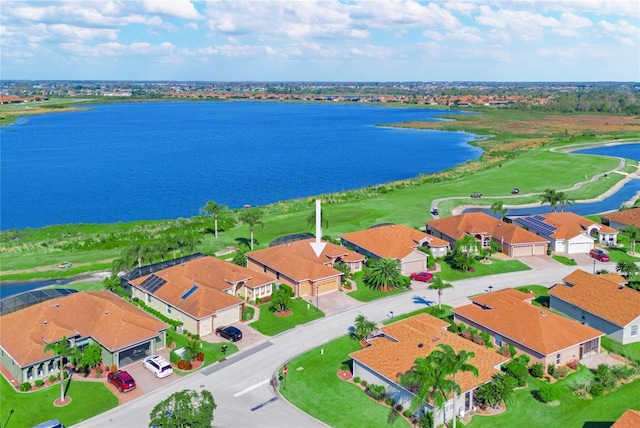 aerial view with a water view and a residential view