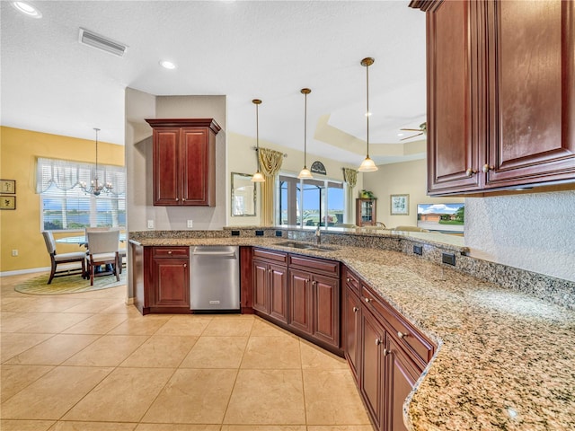 kitchen with a sink, visible vents, dishwasher, a raised ceiling, and pendant lighting