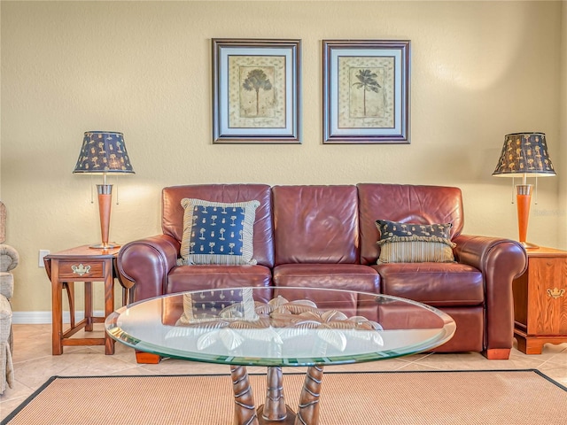 living room with tile patterned flooring and baseboards