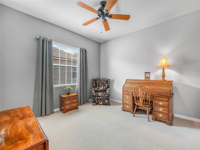 office space featuring carpet, ceiling fan, and baseboards