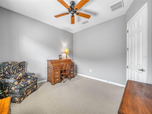 office area featuring baseboards, visible vents, ceiling fan, and carpet flooring