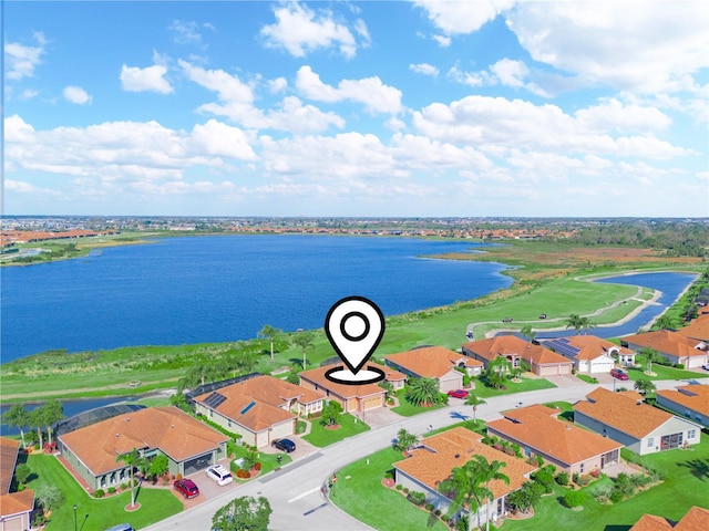 bird's eye view featuring a water view and a residential view