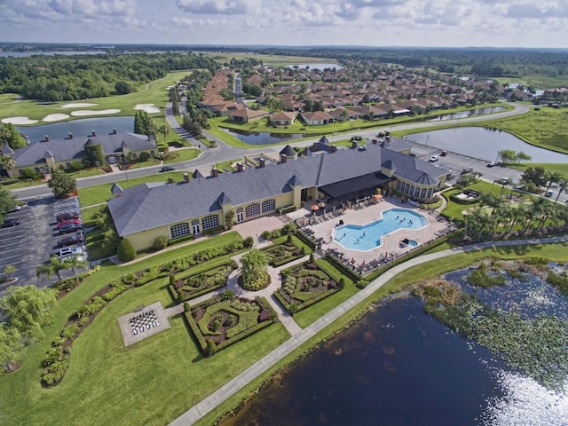 drone / aerial view featuring a water view and a residential view