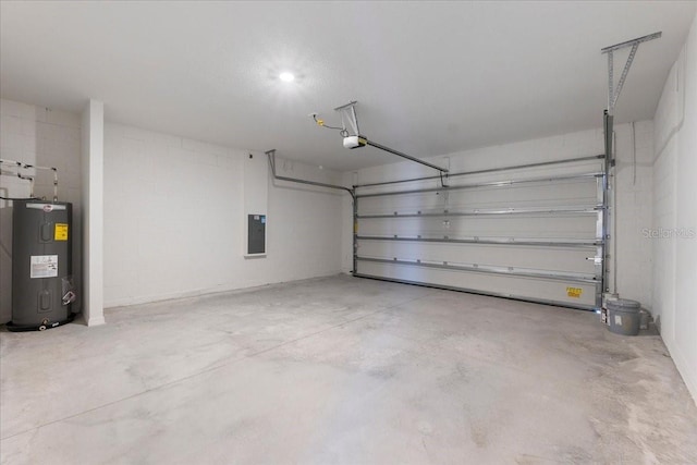 garage featuring water heater, concrete block wall, electric panel, and a garage door opener