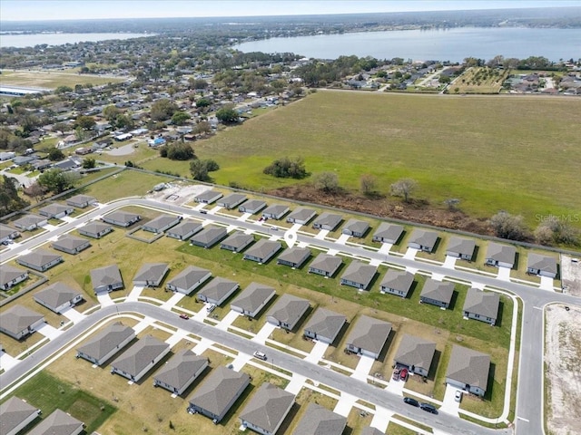 birds eye view of property featuring a residential view and a water view