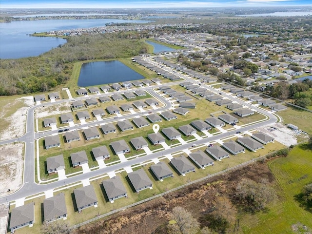 bird's eye view with a water view and a residential view