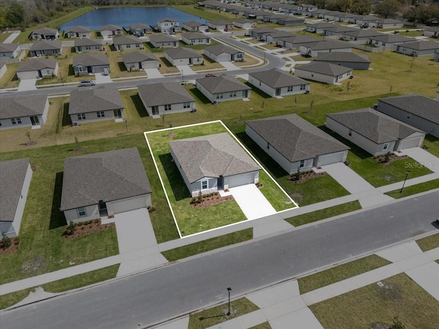 aerial view with a water view and a residential view