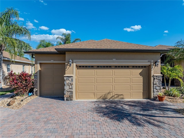 garage featuring decorative driveway