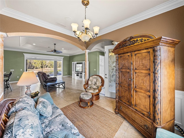 living area with arched walkways, light tile patterned floors, visible vents, and ornate columns