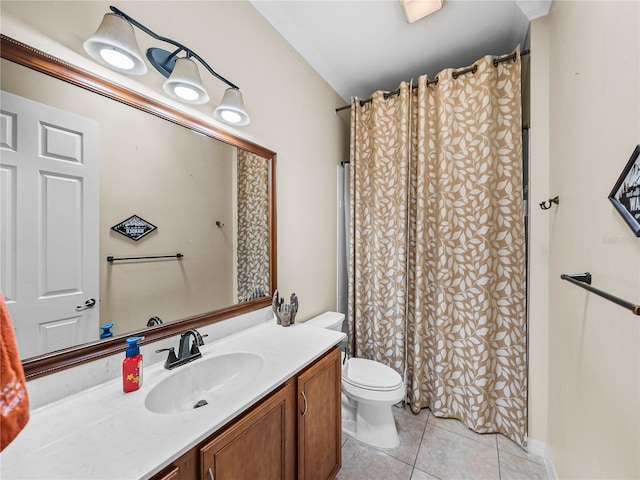 bathroom with tile patterned flooring, a shower with curtain, vanity, and toilet