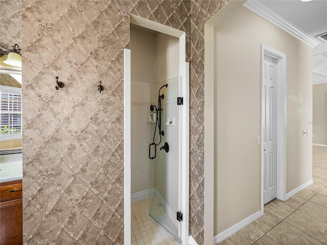 full bath featuring a stall shower, baseboards, visible vents, tile patterned floors, and crown molding