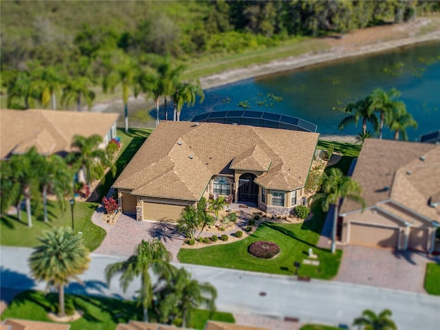 birds eye view of property with a water view