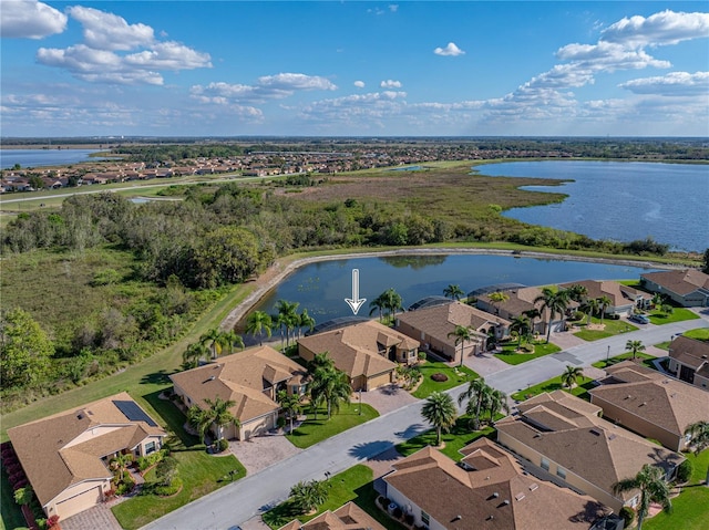 aerial view featuring a residential view and a water view