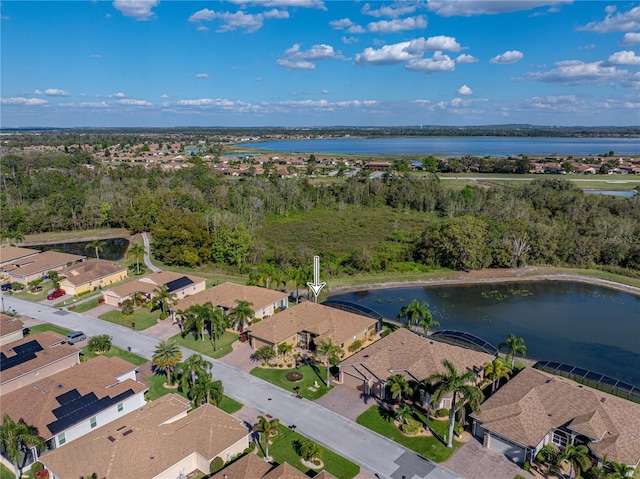 bird's eye view featuring a residential view and a water view