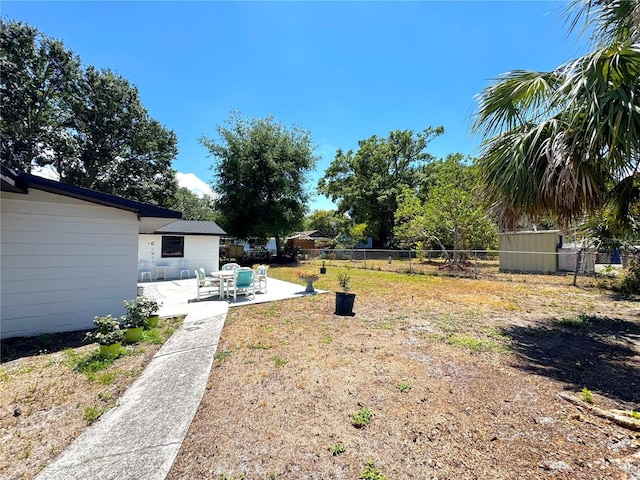 view of yard featuring a patio area and fence