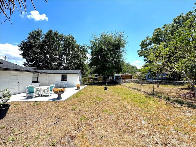 view of yard featuring a patio area and fence