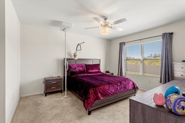 bedroom featuring baseboards, carpet, and ceiling fan