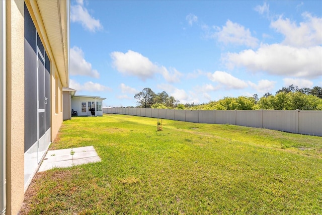 view of yard featuring a fenced backyard