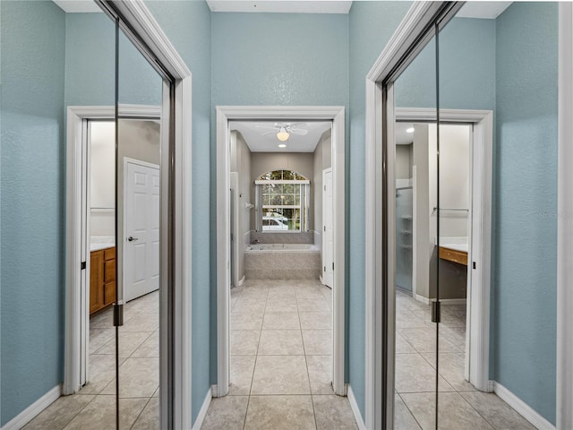 hallway with light tile patterned flooring