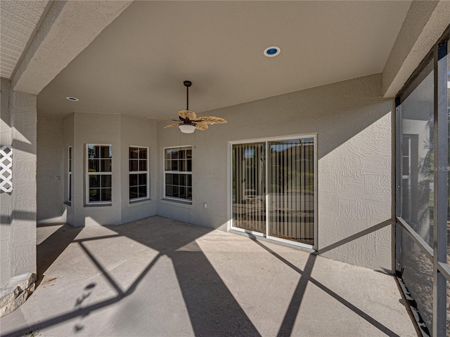 view of patio featuring ceiling fan