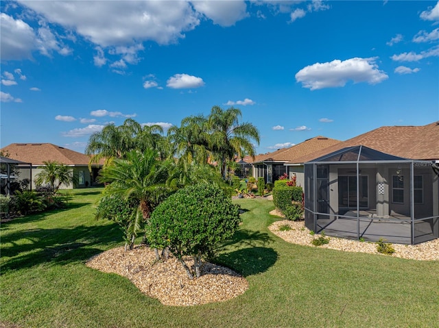 view of yard featuring a lanai
