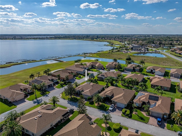 bird's eye view with a residential view and a water view