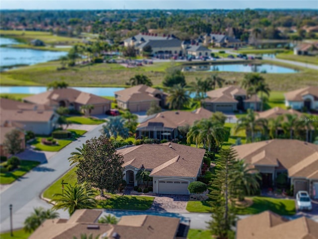 birds eye view of property featuring a residential view and a water view